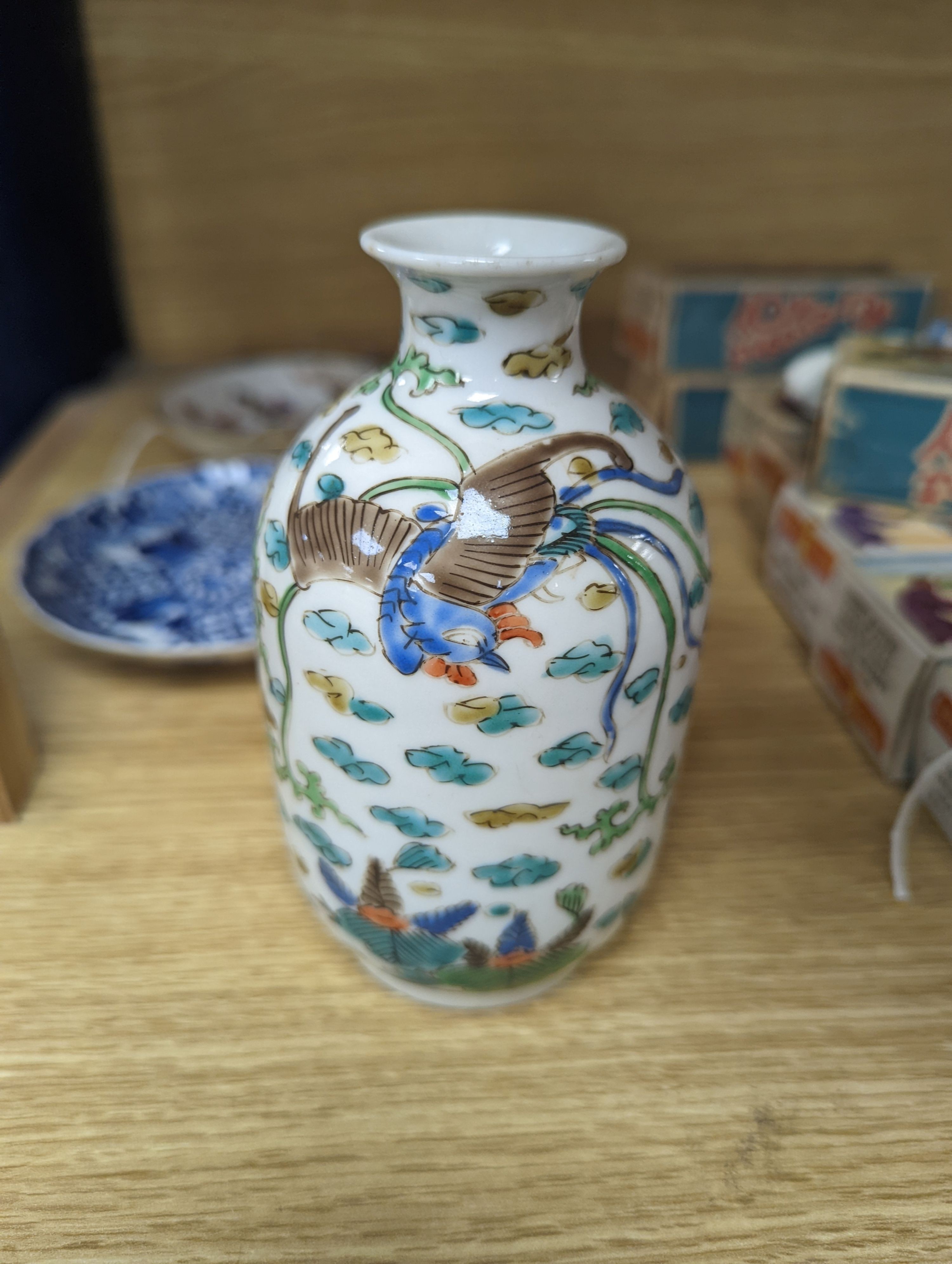 Two Chinese porcelain saucers, and a Chinese enamelled porcelain vase, 12.5cm., 18th century and later